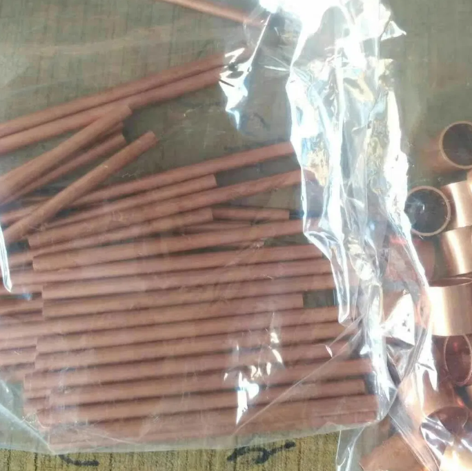 Copper capillary tube close-up showing precision dimensions
