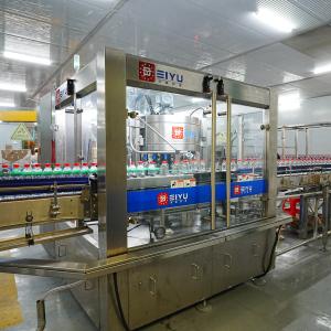 China 24000BPH Hot Melt Glue Labeler Machine Adhesive Labeling Machine With Multi Roll Feeding System wholesale