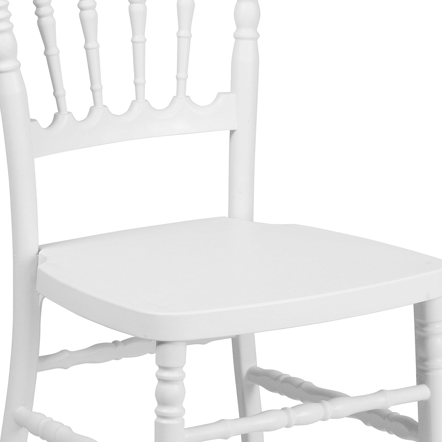 White plastic wedding chairs in banquet hall setup