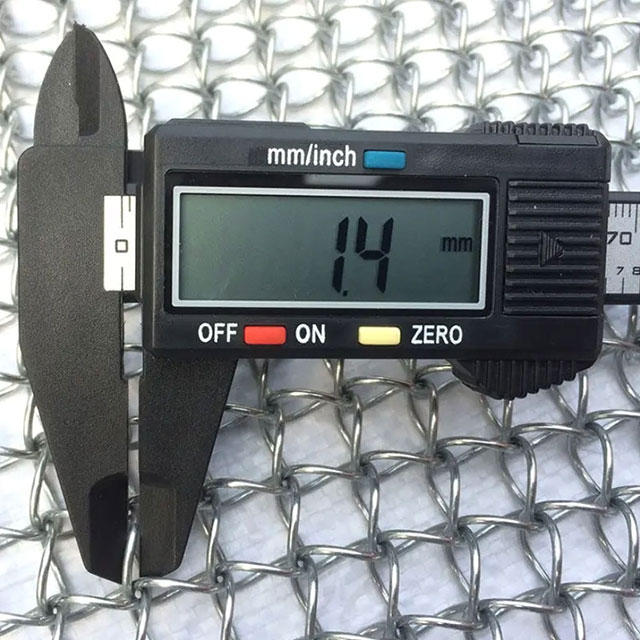 A caliper is used to test the wire diameter of honeycomb architectural mesh