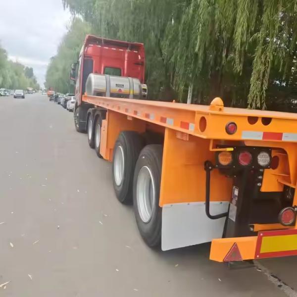 Double Axles Iron Texture Length From 10m To 20m Heavy Duty Low Flatbed Transport Truck Semi Trailer