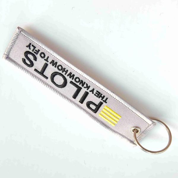 Quality Minimalist Pilot Keychain - "THEY KNOW HOW TO FLY" Quote / Stylish Yellow Trim for sale
