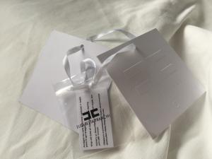 China Debossed Logo White Card Clothing Hang Tags With String Custom Size wholesale