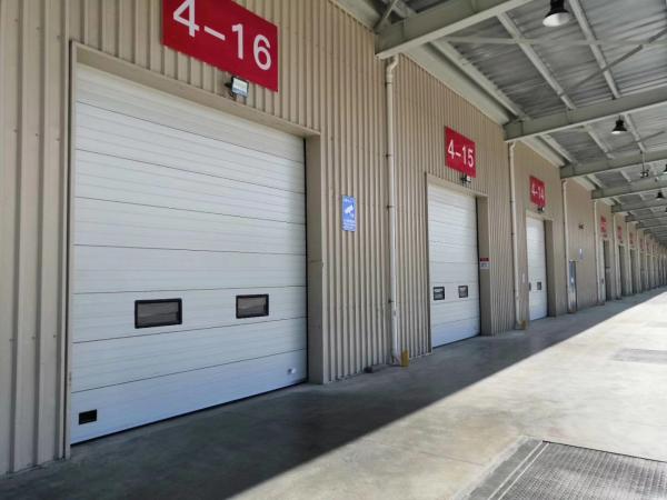 Quality Slide Running Industrial Sectional Door For Factories Logistics Warehouse Garages for sale