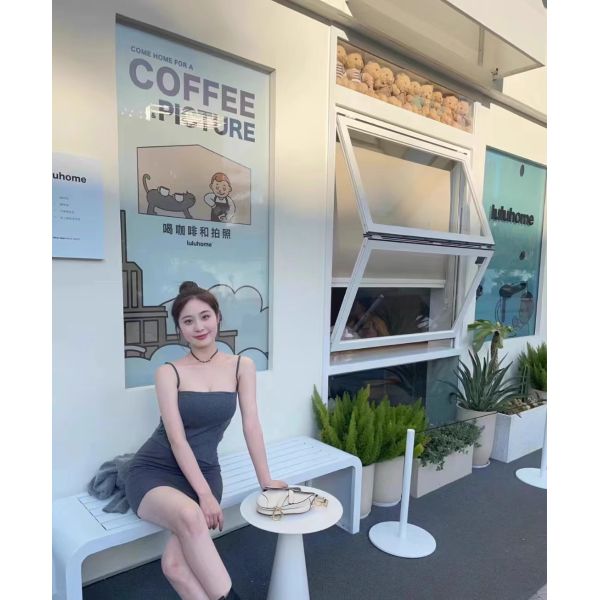 Dusk Wine Country Folding Window Framing Sunset Over Grapevines from Living Room Seating Areas