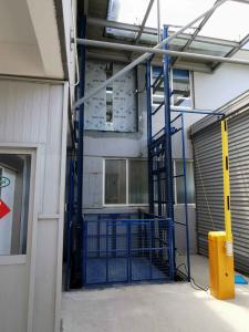 China 4M Vertical Travel 1000Kg Load Guide Rail Elevator Lifting Platform with Transport Systems for Cargo Lifting wholesale