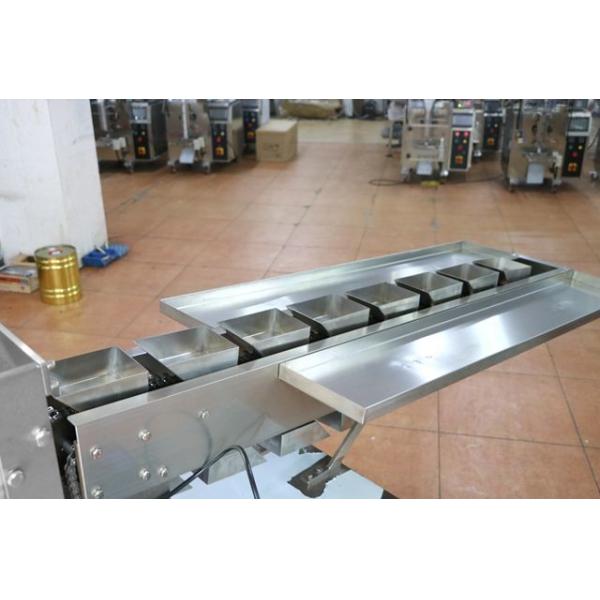 China Automatic bucket chain feeding vertical form fill seal food packing machine in business