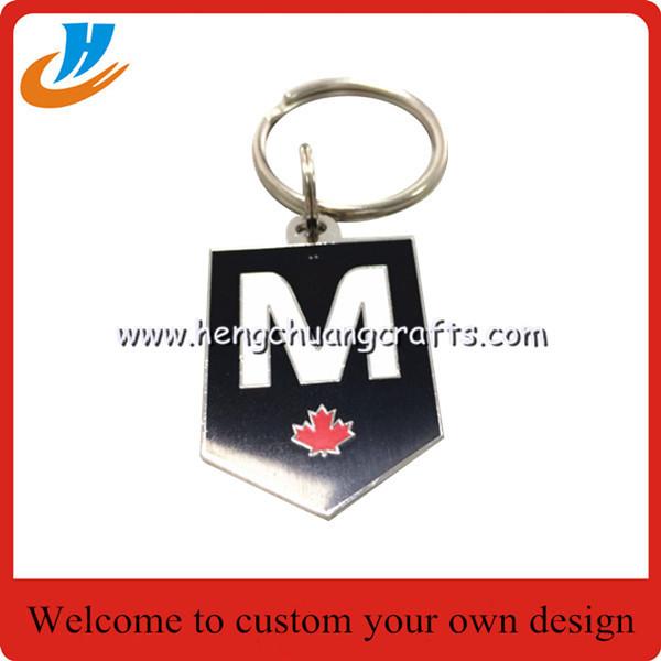 Quality Custom design soft enamel metal keychain/double side plated silver with ring for sale