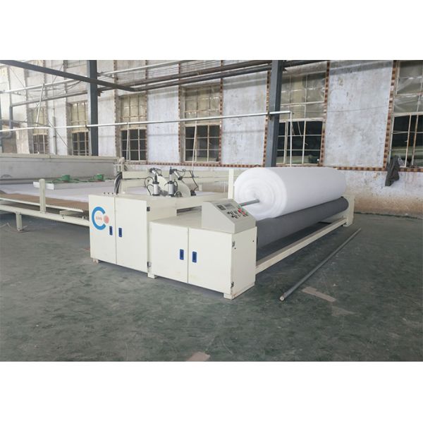 NON-WOVEN ROLL AND CUT MACHINE