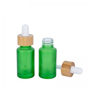 China 30ml Frosted Green Glass Dropper Bottles Essential Oil Bottle With Bamboo Dropper wholesale