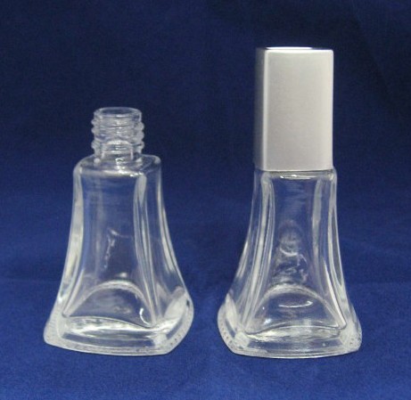 Empty glass nail polish bottle with cap and brush