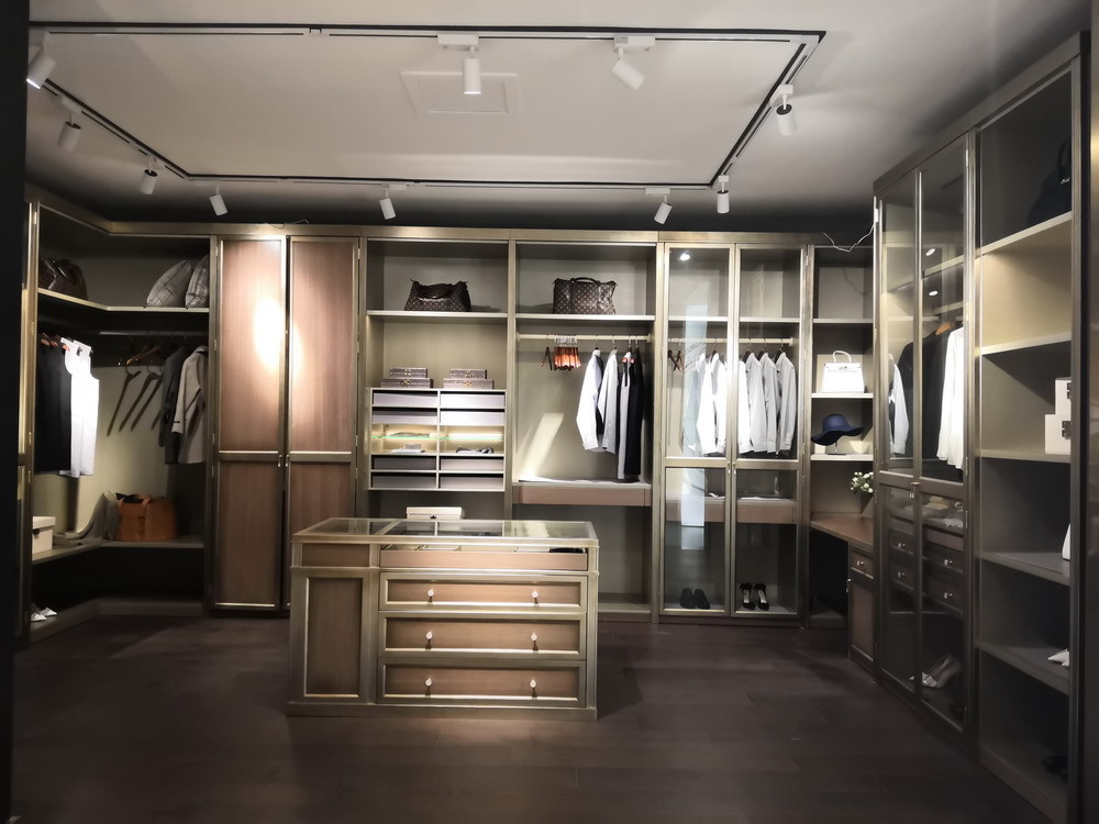 Villa house wardrobe closet in light luxury design Built-in cabinets for cloth and jewelry display wood working counters